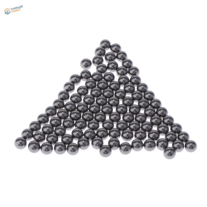 Shiny stainless steel balls in triangular formation for paint mixing