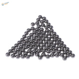 Shiny stainless steel balls in triangular formation for paint mixing