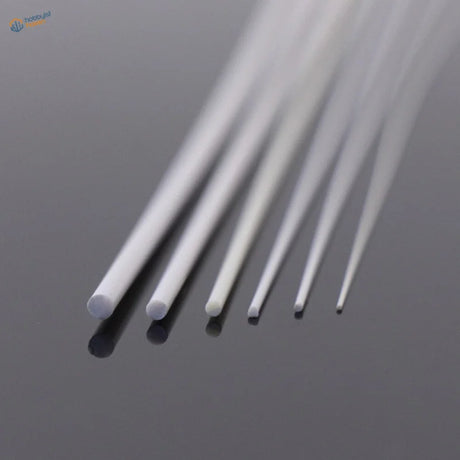 White translucent styrene round rods 0.5-2.5mm on reflective surface