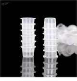 Clear disposable paint mixing cups stacked in two columns
