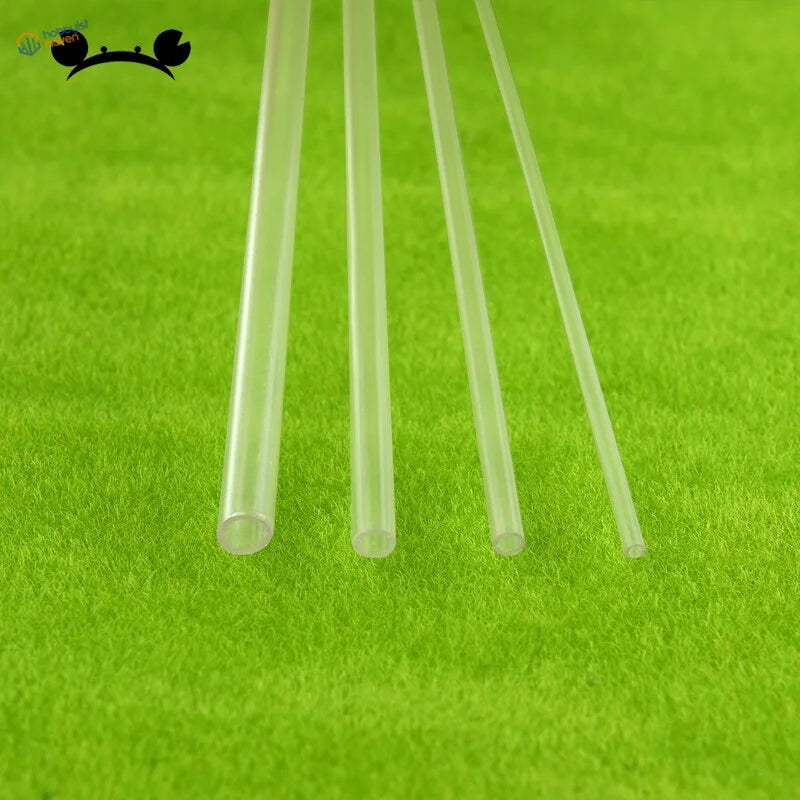 10pcs 2-6mm transparent plexiglass tubes on green textured surface