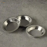 Three shiny 12pcs stainless steel pie pans with raised edges