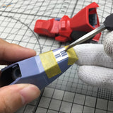 Gundam models carving template applying silver detail to blue part with panel lines