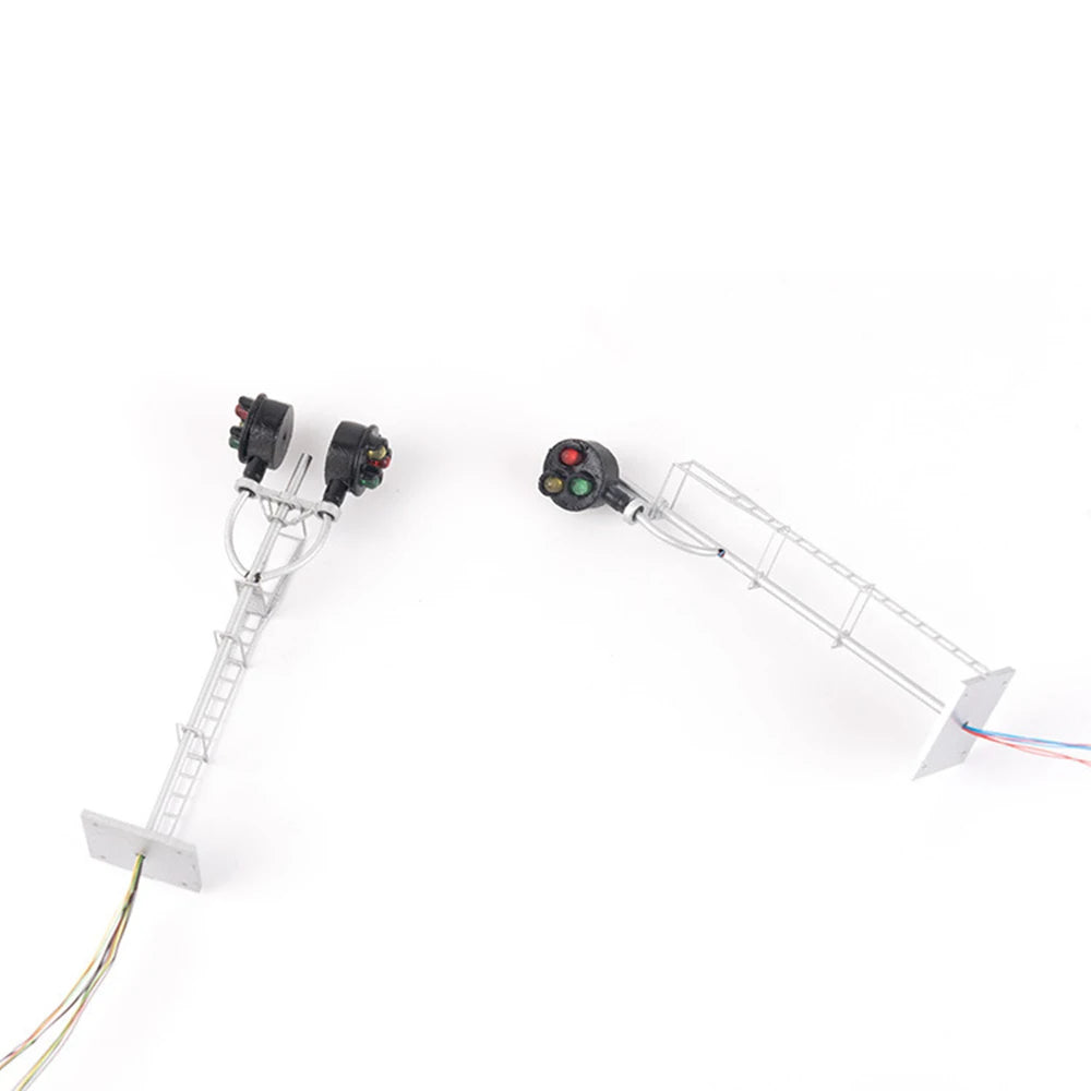 Two HO scale searchlight block signals with pre-wired leads