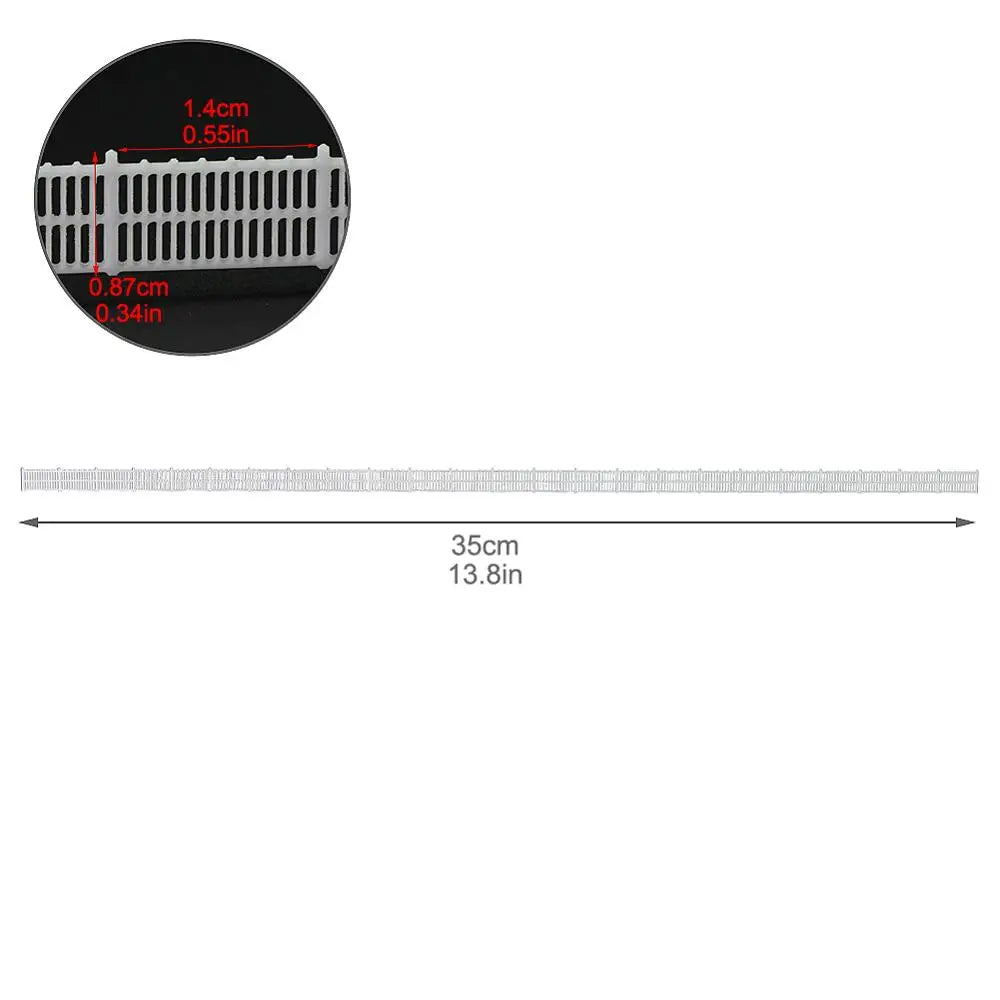 N scale white plastic garden edging strip with textured ribbed surface and rectangular slots for station platform use