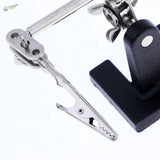Silver alligator clips on 2.5x magnifying glass for soldering scale modeling