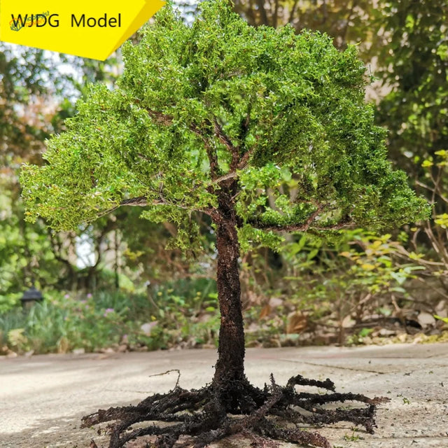 Detailed scale model tree with lush green foliage and textured trunk