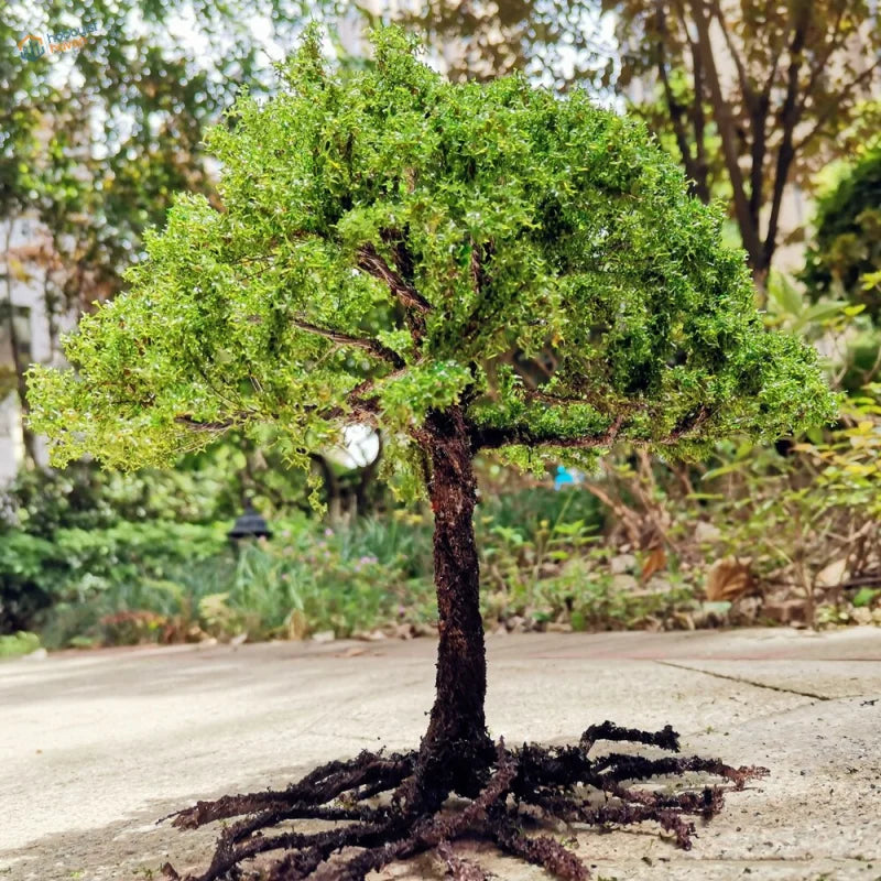 Scale model tree with green foliage and a detailed brown trunk