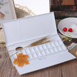 24 grid watercolor paint palette in white plastic with wheat stalk accents