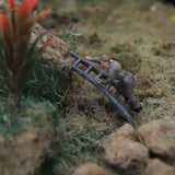Gray plastic Ho scale 1:87 model railway worker climbing blue ladder