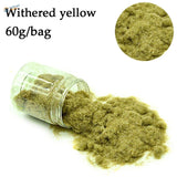 Withered yellow 2mm static grass powder spilling from glass jar