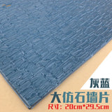 Gray-blue faux stone roof simulating PVC panel with textured brick pattern