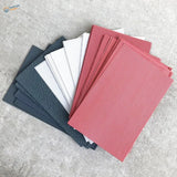 Stack of colorful roof simulating PVC panels in red, white, gray textures