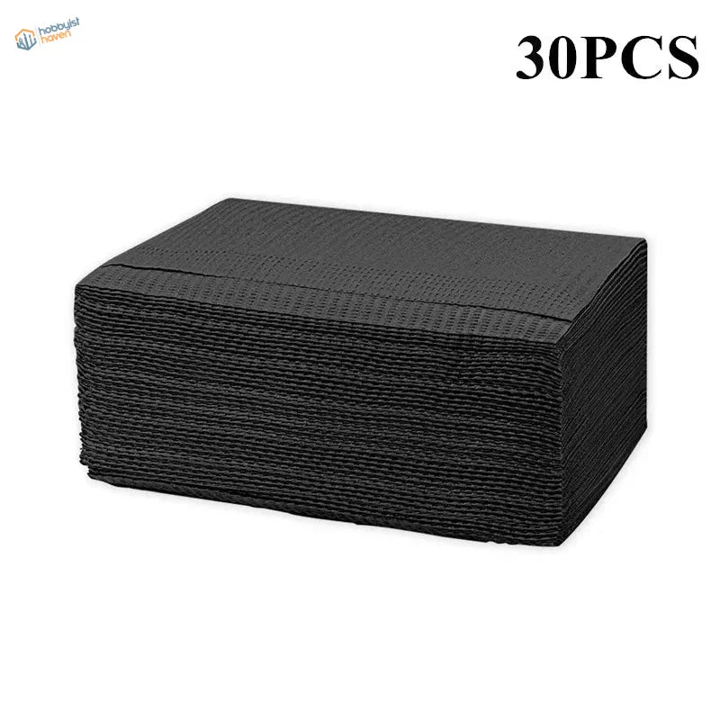 Stack of 30 black textured paper napkins for precision hobby tools