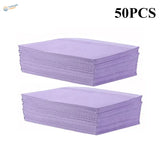 Stacks of 50 purple ribbed disposable clean pads for precision hobby tools