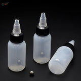 Three 30/60/120ml translucent squeeze bottles with steel mixing ball, one on side