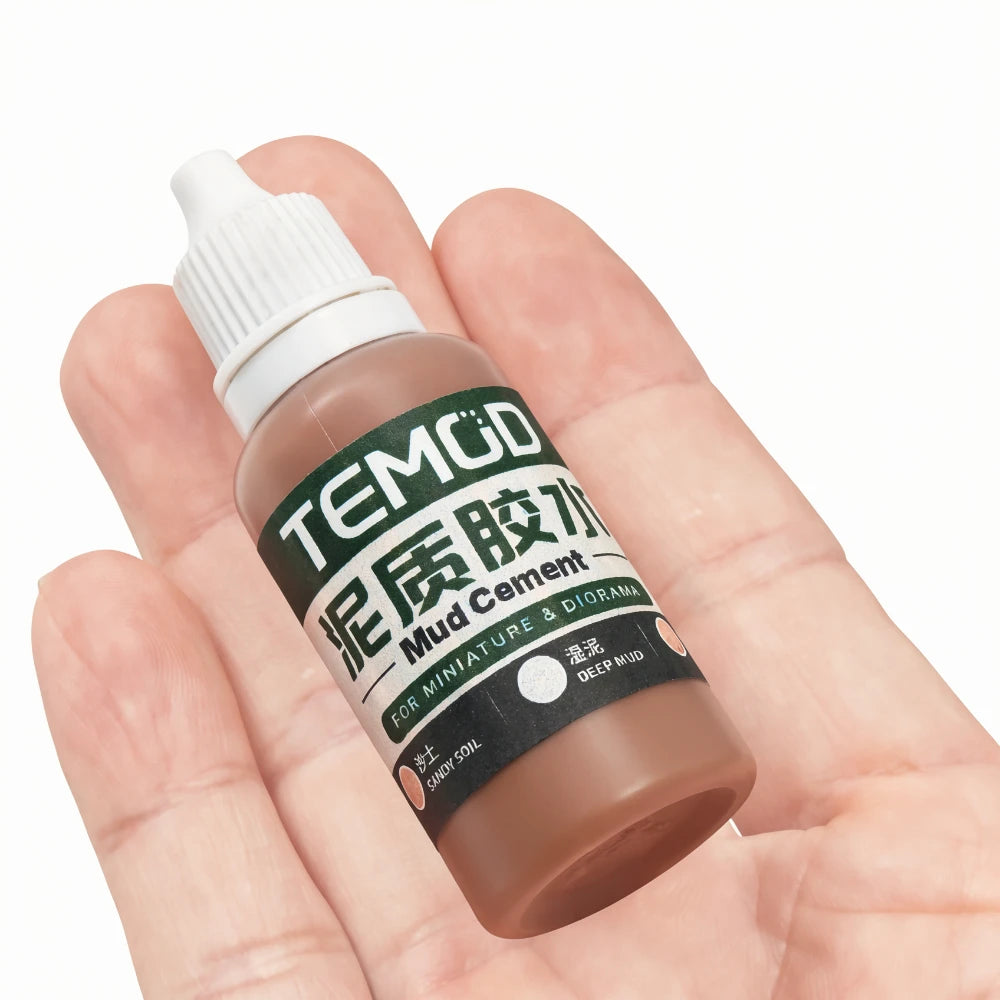 TEMOD mud cement bottle held in a hand for scale