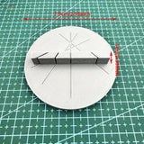 Gray 3D-printed circular base of 3D-printed multi-angle cutting aid with three rectangular magnetic segments