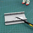 Gray 3D-printed angle ruler on precision hobby tool cutting jig