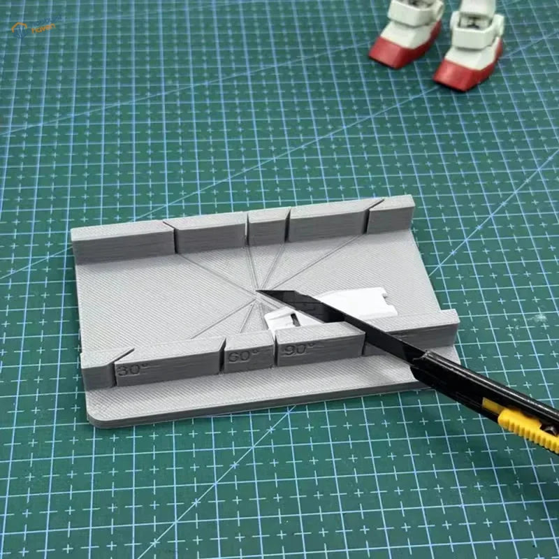 Gray 3D-printed angle ruler on precision hobby tool cutting jig