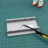 Gray 3D-printed angle ruler on precision hobby tool cutting jig