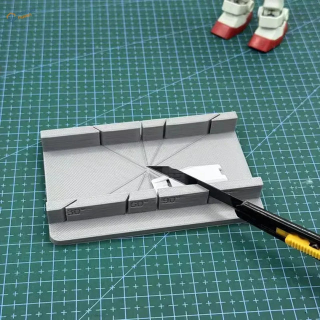 Gray 3D-printed angle ruler on precision hobby tool cutting jig