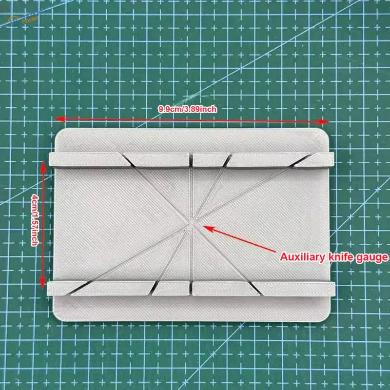 White 3D-printed cutting jig gauge with diagonal slots, precision hobby tool