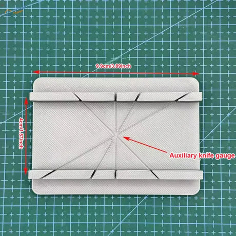 White 3D-printed cutting jig gauge with diagonal slots, precision hobby tool