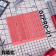 Pink gzpro-01 cutting mat with 3D-printed details and grid for scale modeling tools