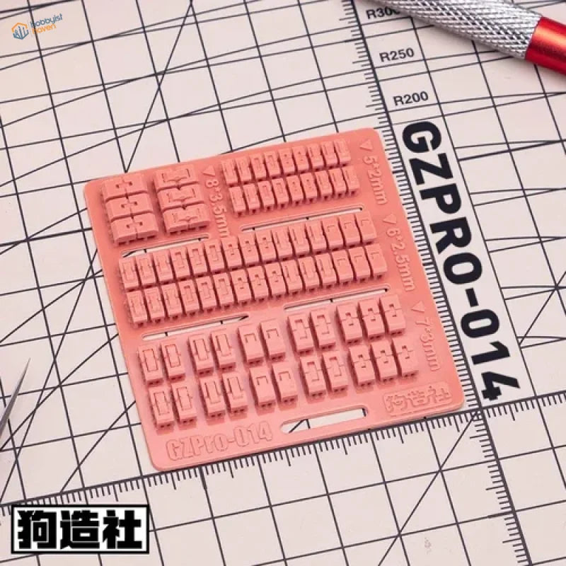 Pink silicone keycap mold with 3D-printed details for scale modeling tools
