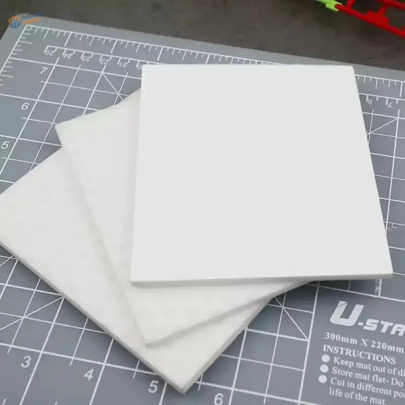 3pcs deglossing pads: three white rectangular foam boards stacked on cutting mat