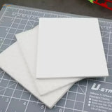 3pcs deglossing pads: three white rectangular foam boards stacked on cutting mat