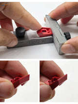 Red plastic watch band buckle measured with metal gauge for sandpaper holder