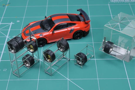 Orange black model race car rear spoiler on 1/64 tire rack shelves