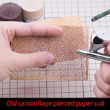 Tan craft paper marbling stencil with perforated camouflage pattern airbrushed