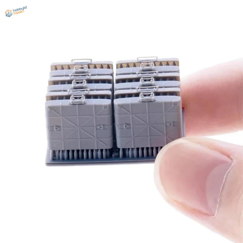 Gray plastic 1/35 scale model of stacked German M24 grenade cases