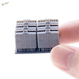 Gray plastic 1/35 scale model of stacked German M24 grenade cases