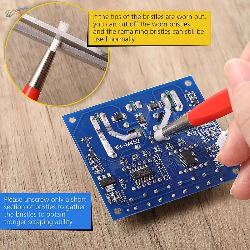 Red-handled brush pen with white bristles from a 4pcs brush pen set for delicate cleaning on blue circuit boards