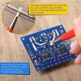 Red-handled brush pen with white bristles from a 4pcs brush pen set for delicate cleaning on blue circuit boards