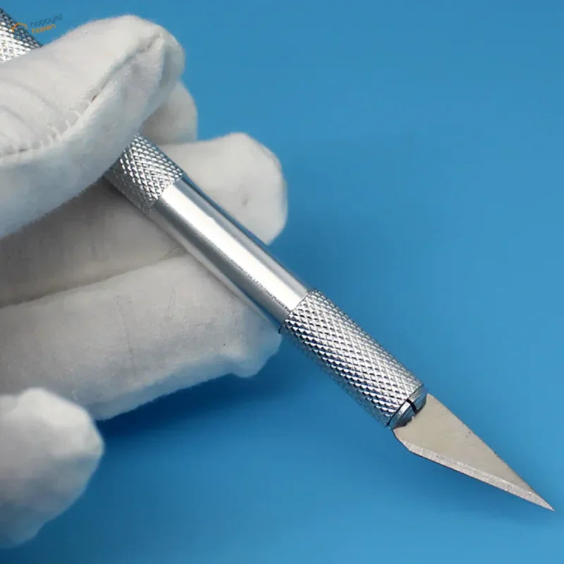 Precision hobby knife with textured grip and sharp blade