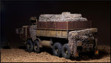Detailed 1/35 military dump truck model with weathered paint and camouflage nets