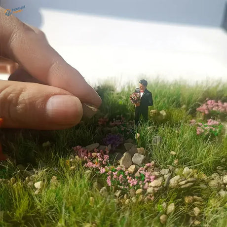Miniature groom figurine on 50g bag of ballast gravel rocks