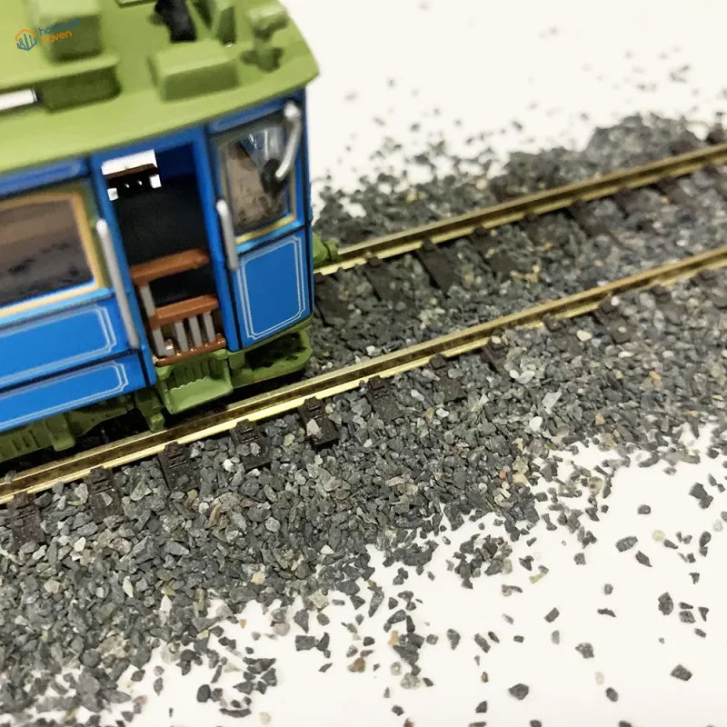 Blue green model trolley on 50g ballast gravel bag with detailed interior