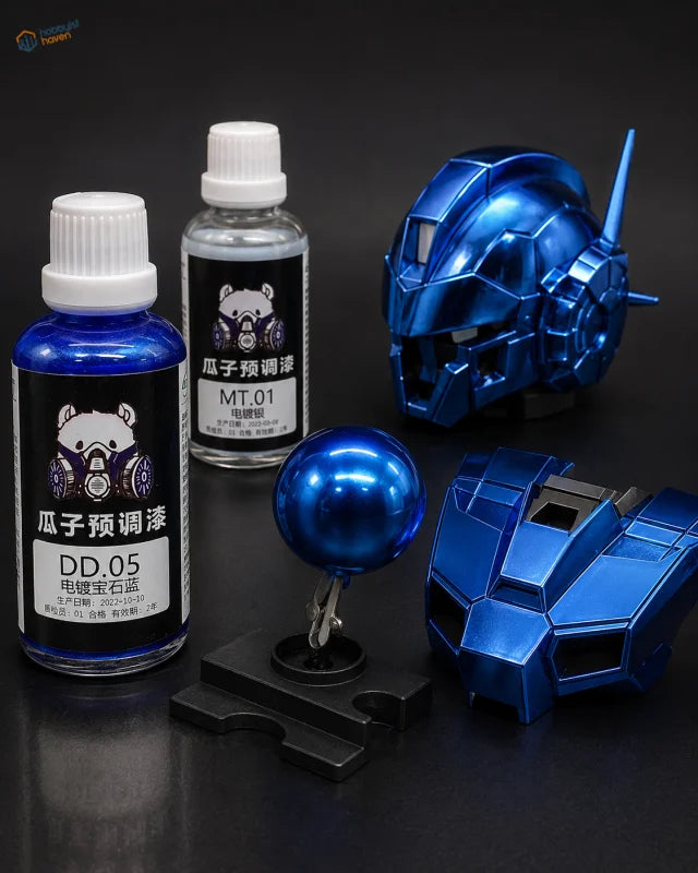 Shiny metallic blue gundam model parts displayed with 50ml electroplated color paint bottles for modeling tools use