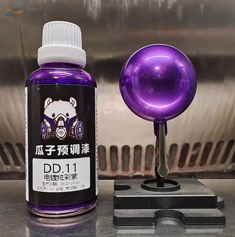 Purple electroplated mirror-chrome paint sample sphere on a black stand