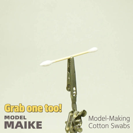 MAIKE double round tip cotton swab held by a clip against a plain background