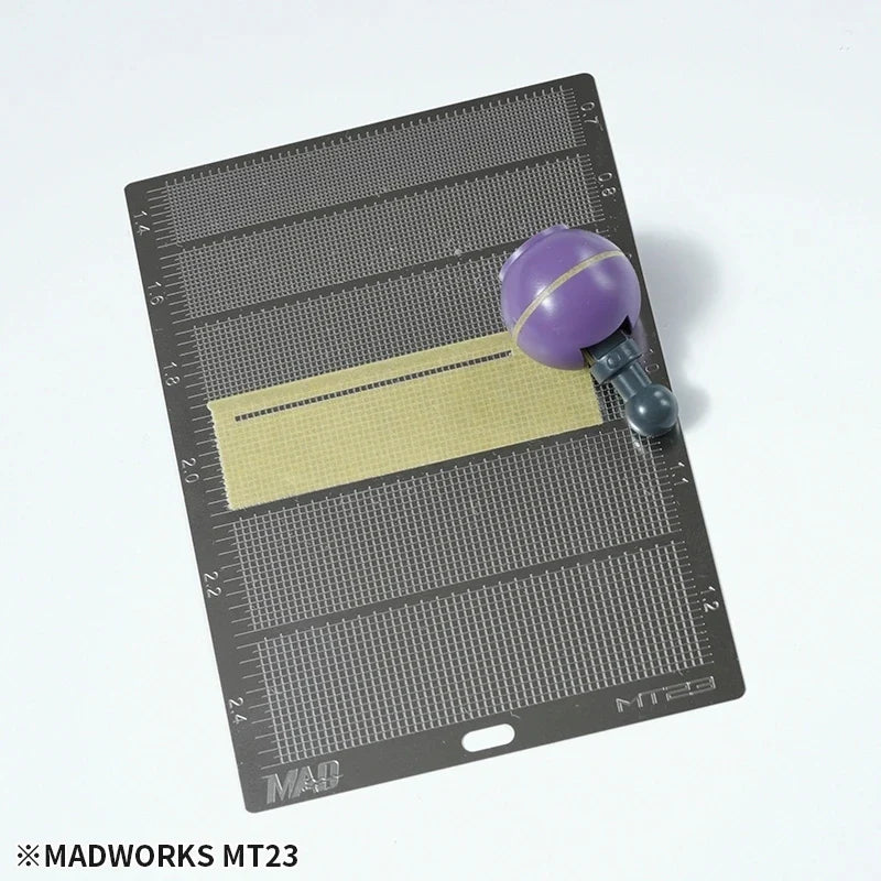 Purple spherical MadWorks masking tape cutting template tool on MT23 mat