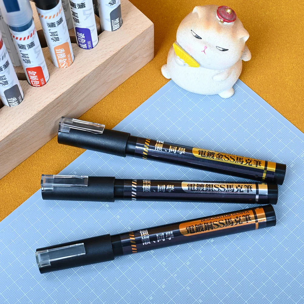Three black water-based electroplating marker pens with gold orange accents Chinese text