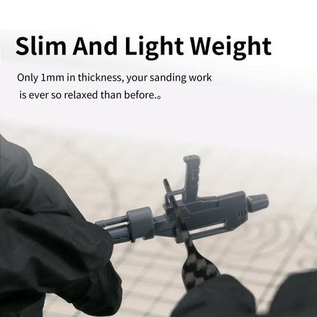 Gray plastic firearm model on DSPIAE carbon fiber sanding plates