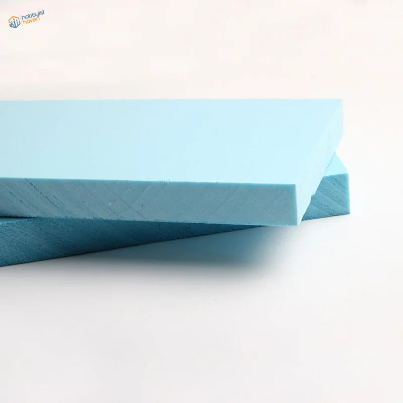 Light blue rectangular foam slabs with smooth textured surface and edges